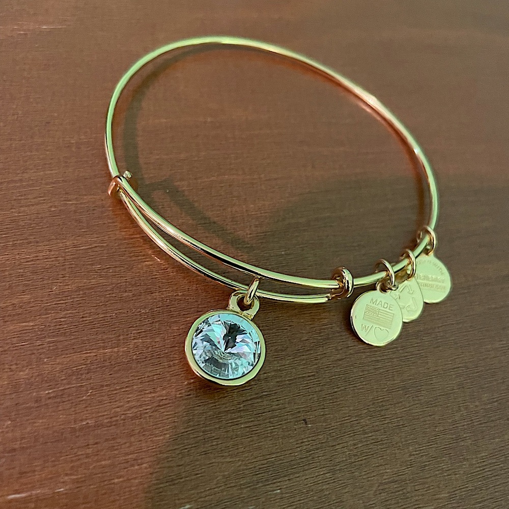 NWOT Crystal Gold Alex and Ani bracelet never worn. Very shiny! Great gift!